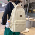 Sac à dos en velours côtelé blanc écru avec pendentif pour adolescents